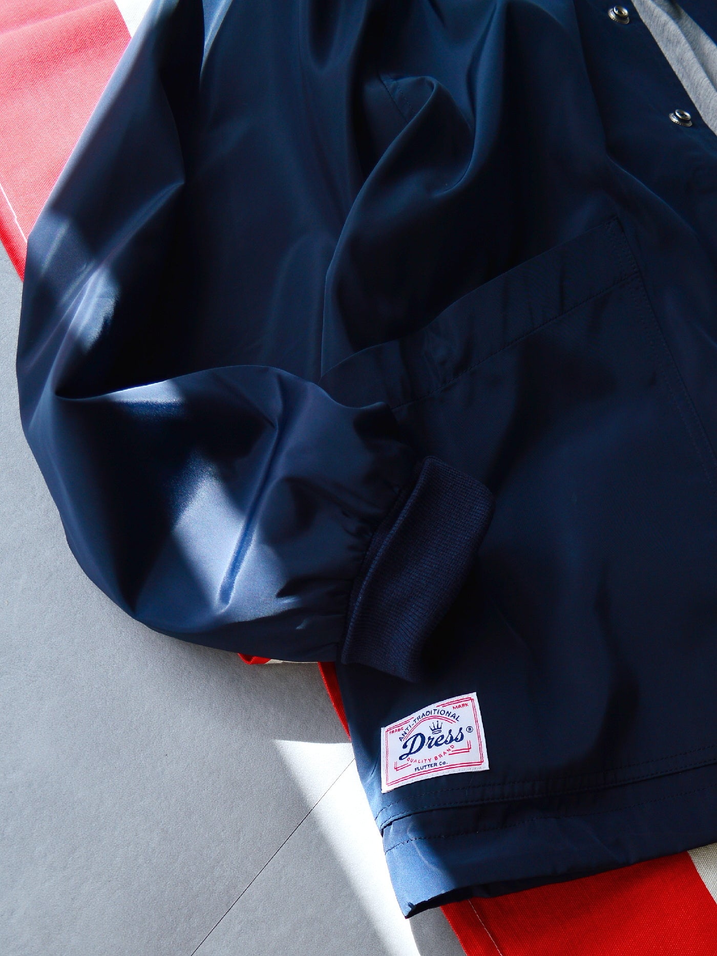 【9.21 (Sun) 12:00 Release】FLUTTER | "The Dress" OG Logo Windbreaker - Navy