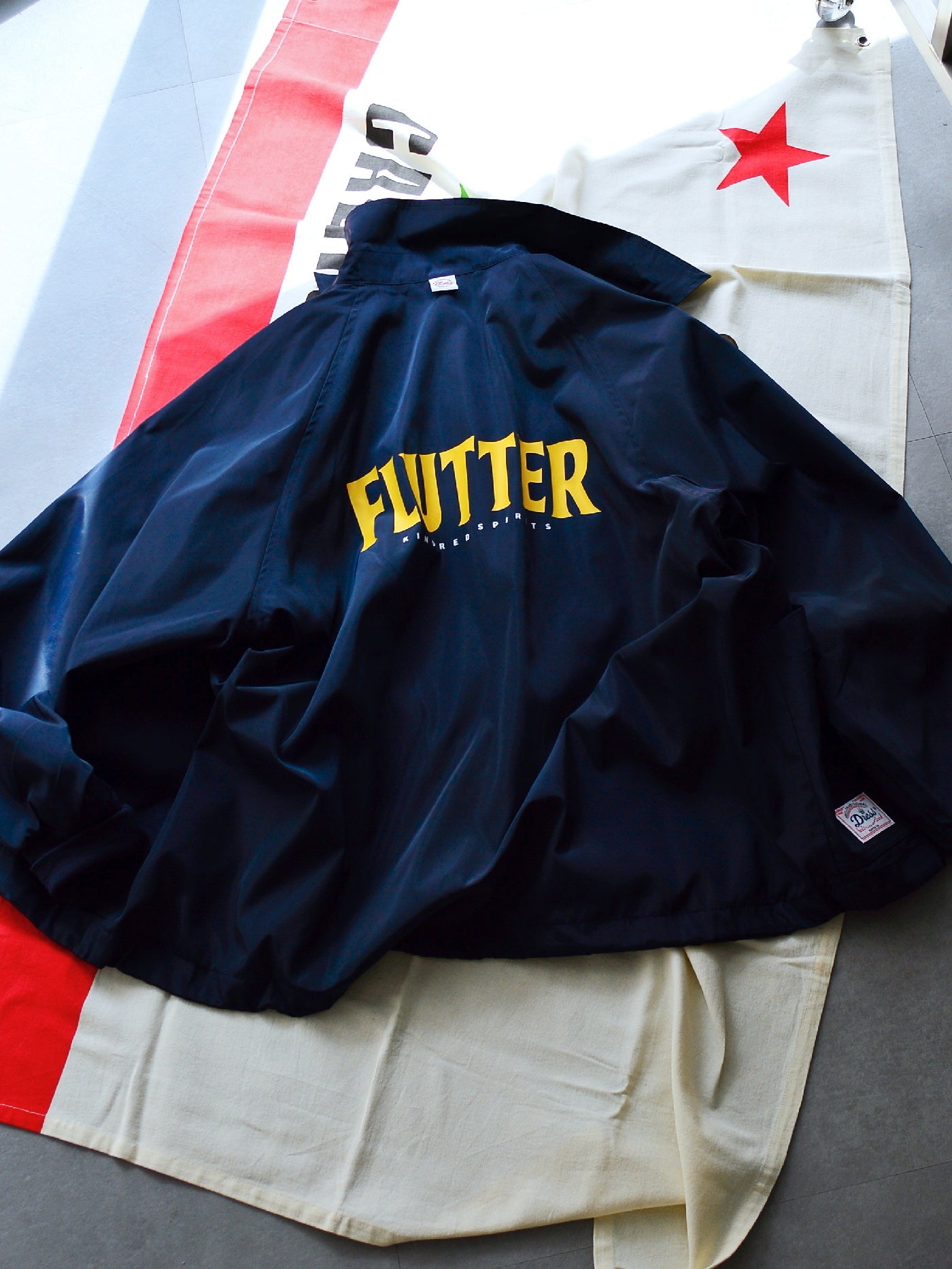 【9.21 (Sun) 12:00 Release】FLUTTER | "The Dress" OG Logo Windbreaker - Navy
