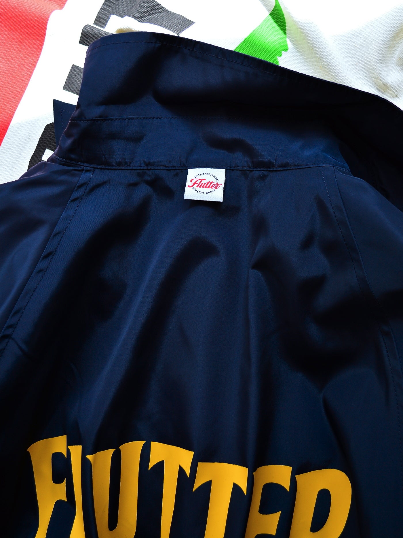 【9.21 (Sun) 12:00 Release】FLUTTER | "The Dress" OG Logo Windbreaker - Navy